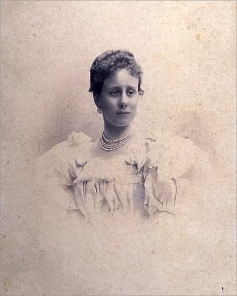 Half-length portrait of a lady in an elegant dress with bows and lace and a four string pearl necklace