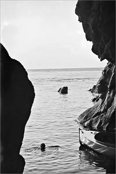 Woman photographed while swimming near Enfola, Elba Island