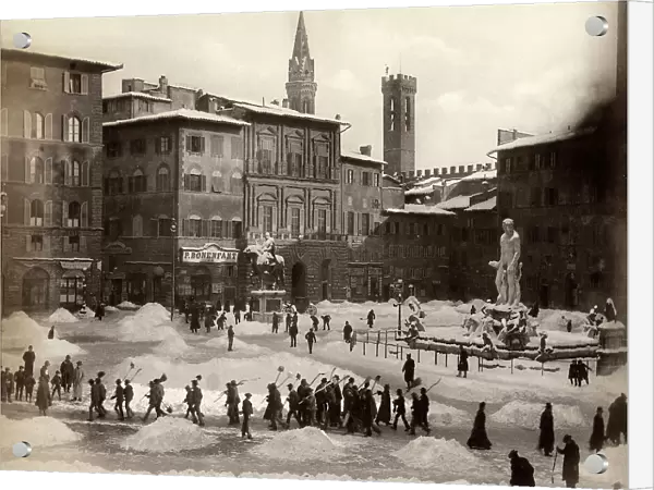 Snow shovellers in Piazza della Signoria in Florence after an exceptional snowfall
