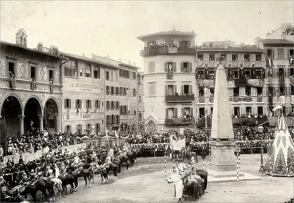 View of S. Maria Novella Square, in Florence, during the Saracen carousel. Palaces are decorated with banners and standards. At the square centre the walkers-on in costum parade on horseback, holding flags and standards