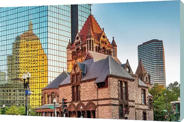 Massachusetts, Boston, Trinity Church and Berkeley Building reelecting on modern building on Boylston Street and Clarendon Street
