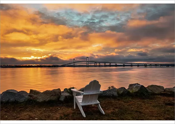 Rhode Island, Newport, adirondack chair facing Claiborne Pell Bridge over Narragansett Bay