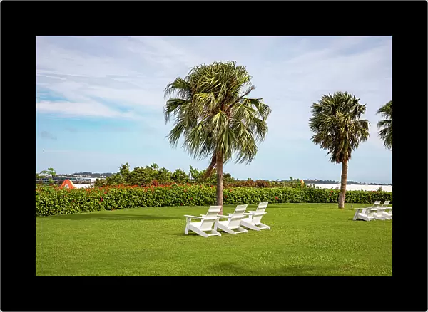 Bermuda, Outdoor chairs on green lawn at Grotto Bay Beach Resort & Spa