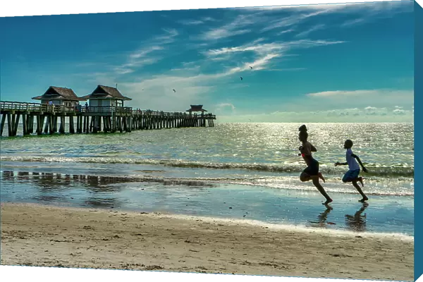 Florida, Naples, Fishing Pier, kids running on the beach