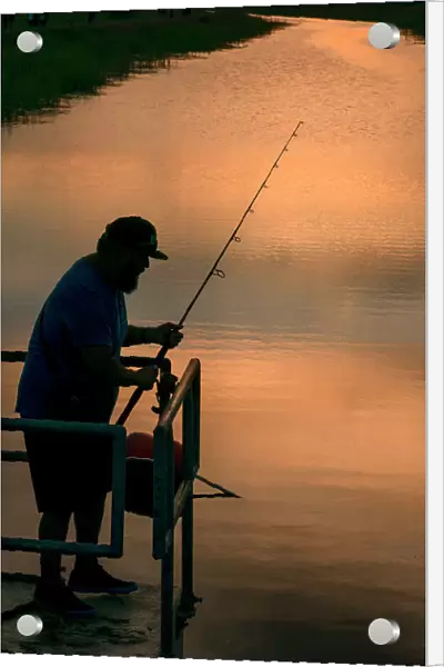Florida, Everglades, man fishing in canal