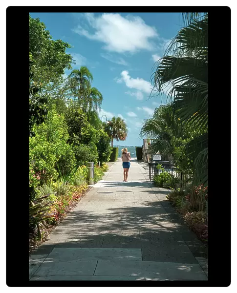 Florida, Miami, Villa Vizcaya, woman walking towards water