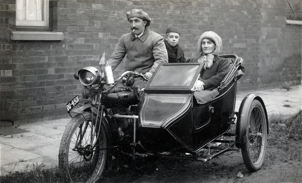 Family of three on a 1915 Indian motorcycle