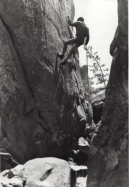 French boy scout rock climbing