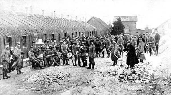 A German band, with top-hatted conductor, in an enemy camp at the front