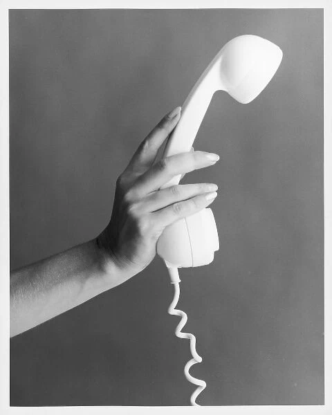 Hand Holds a Telephone