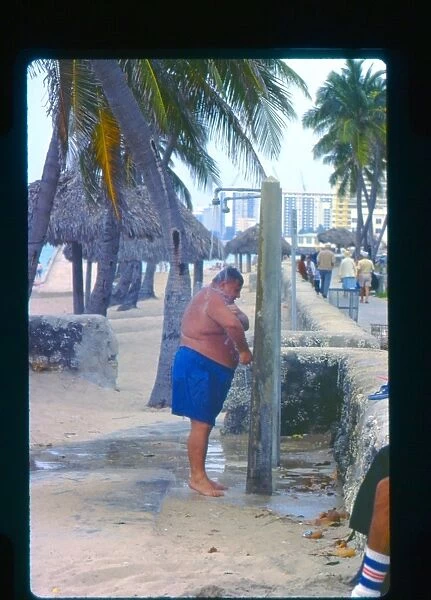 Large man taking a shower, Florida, USA