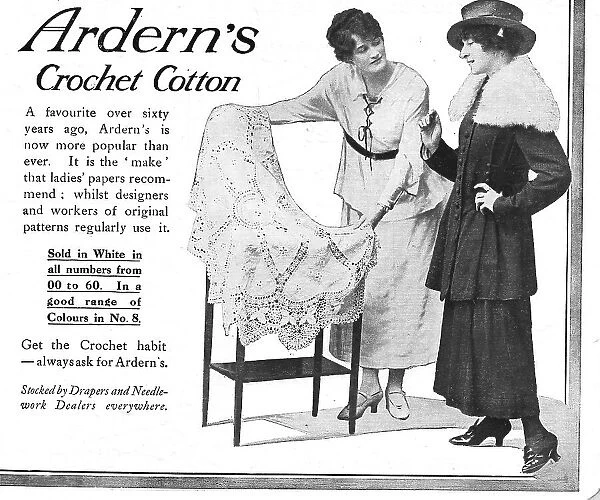 Two models discussing a fabric held out by the draper. Advert for Arden's Crochet Cotton. Date: 1918