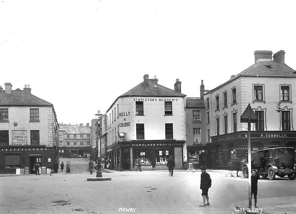 Newry - a street scene of Margaret square with shop fronts, people