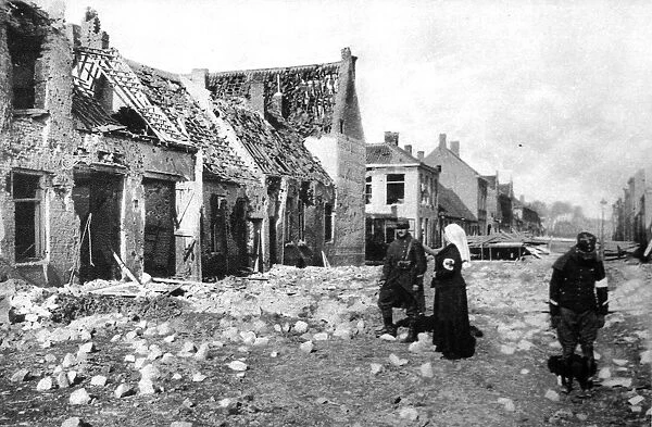 Photographed during the fierce German bombardment of the town: A ruined street in Nieuport