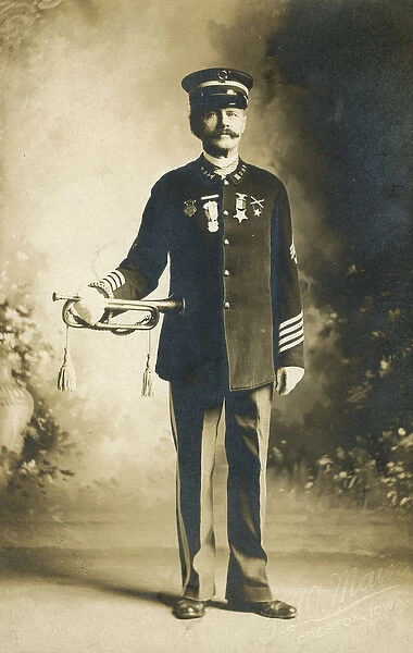 Portrait photograph of an American army officer with a bugle