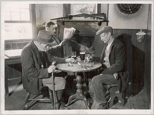 Pub Dominoes 1930S. A game of dominoes in an English country pub