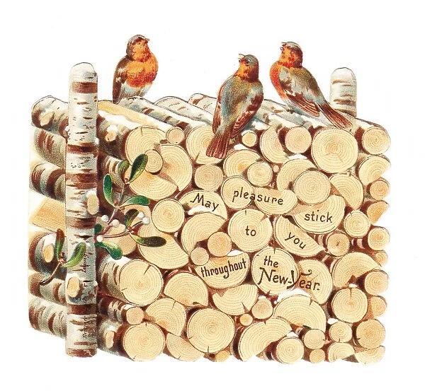 Robins perched on a pile of logs on a cutout New Year card