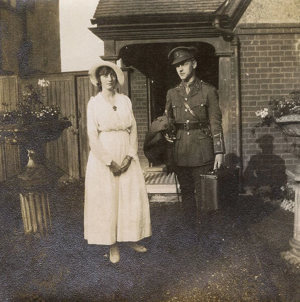 Soldier with fiancee outside her home, WW1