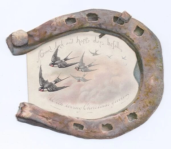 Swallows and rusty horseshoe on a Christmas card
