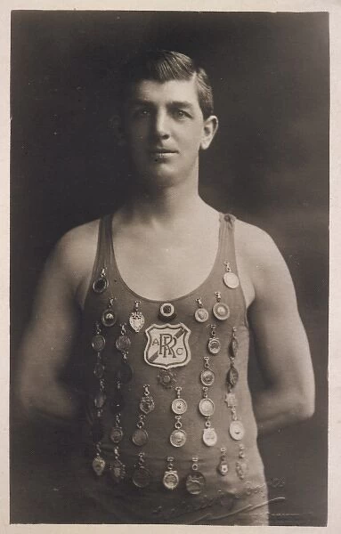 Swimming champion with medals on his costume