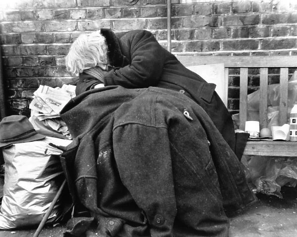 Tramp asleep on a Balham street, SW London