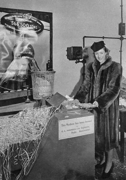 Vera Lynn shredding her fan mail for the war effort