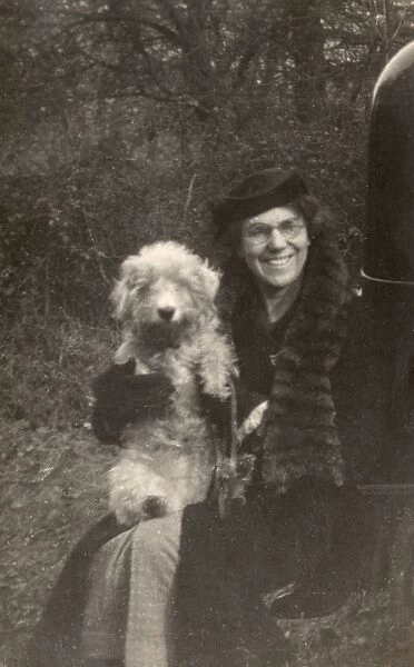Woman holds her dog