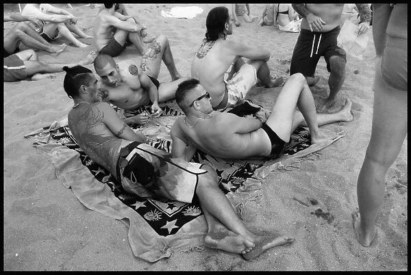 Young men on beach - Marina di Pisa, Italy