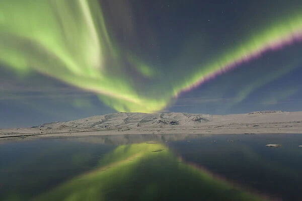 Northern Lights over lake in Iceland - Aurora Borealis