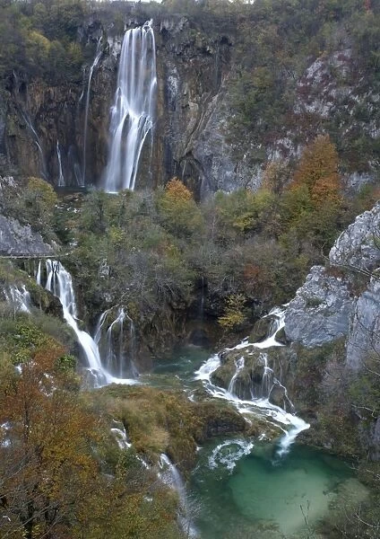 Plitvice National Park, Croatia. Series of lakes in valley, separated by travertine (tufa) dams: cascades over one of the dams