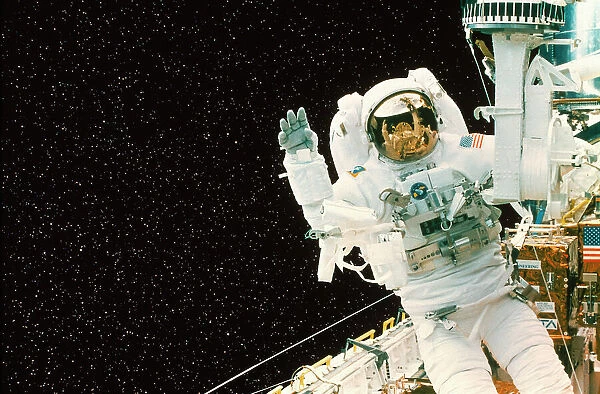 Astronaut spacewalks to repair Shuttle Telescope