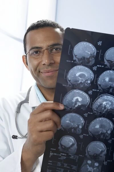 Doctor holding MRI scans