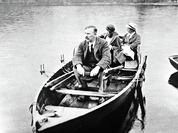 E. Rutherford with his wife and daughter in a boat