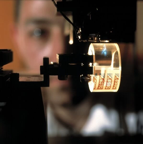 Laser writing optical data onto adhesive tape