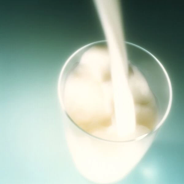 Milk. Milk being poured into a glass. Milk is a good source of the essential