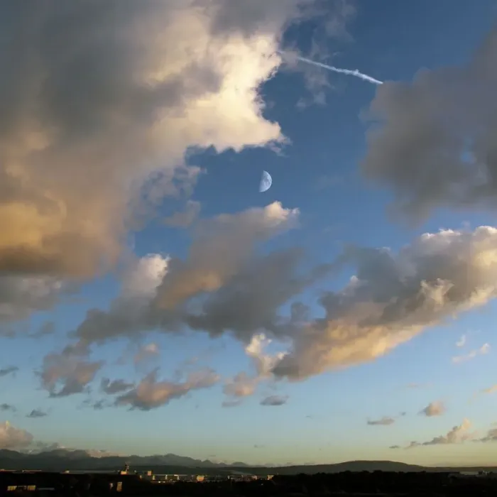Framed Print : Print of Quarter Moon between clouds at sunset Framed Print : Print of Quarter Moon between clouds at sunset