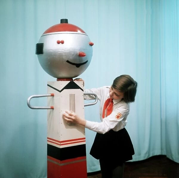 Schoolgirl with performing robot C016  /  8377