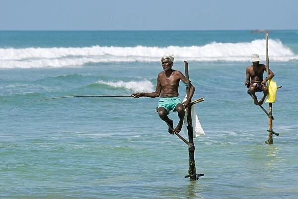 Stilt fishermen in Sri Lanka C017  /  9991