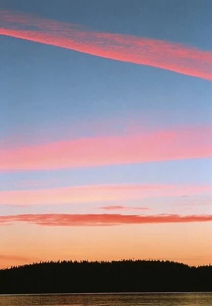 Sunset illuminating clouds over Hesquiat Harbour
