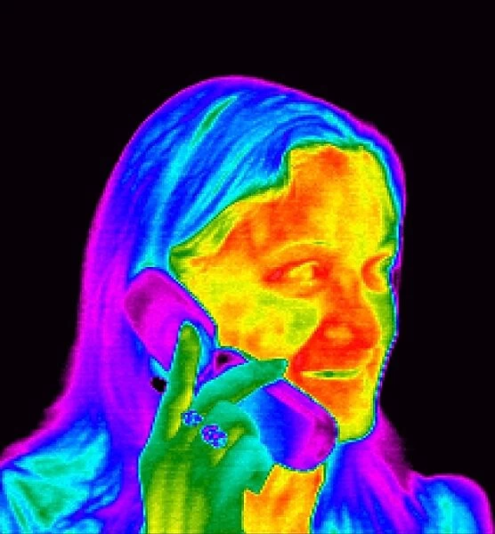 Woman using a mobile phone, thermogram