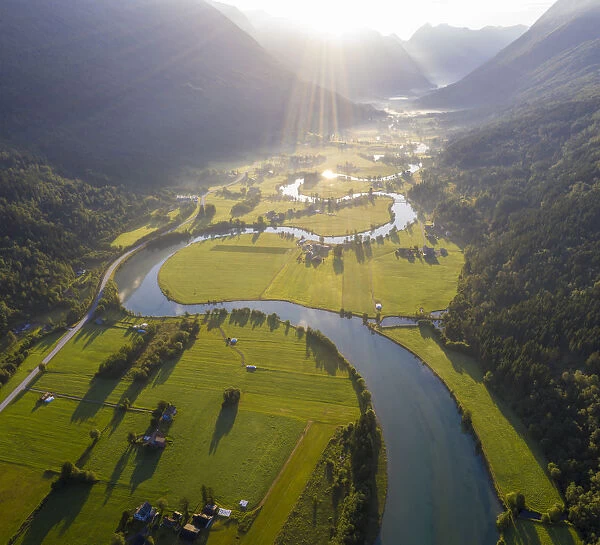 Aerial panoramic of Stryneelva river and fields during a misty sunrise, Stryn, Nordfjorden