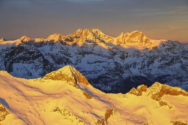 Aerial view of peak Baroni and Bernina Group at sunset, Masino Valley, Valtellina