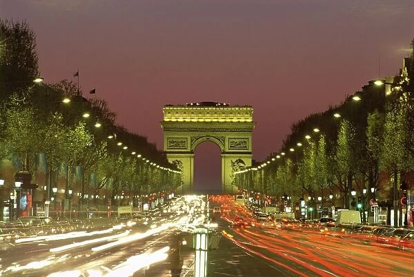 Avenue des Champs Elysees and the Arc de Triomphe at night, Paris, France, Europe