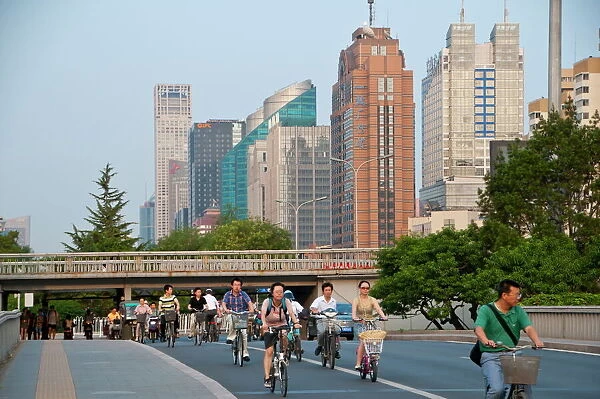 Bicycles and motorbikes in downtown Bejing, China, Asia
