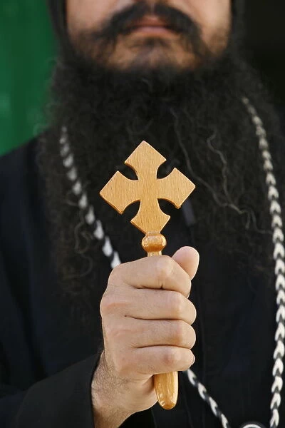 Egyptian Orthodox Coptic priest holding cross, Jerusalem, Israel, Middle East