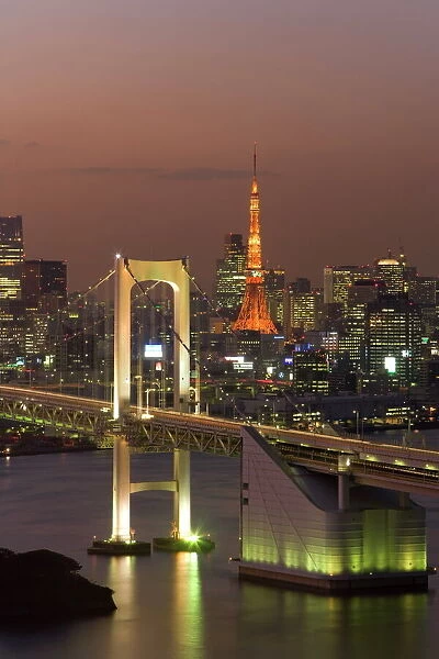 Elevated view of Rainbow Bridge and Tokyo Tower illuminated at dusk