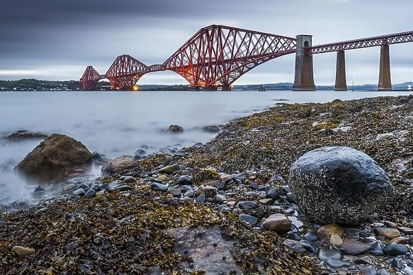 First light over the Forth Rail Bridge, UNESCO World Heritage Site, and the Firth of Forth