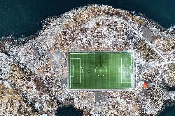 Football field on islet from above, aerial view, Henningsvaer, Nordland county, Lofoten Islands, Norway, Scandinavia, Europe