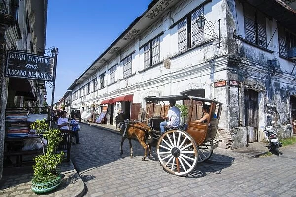 Horse cart riding through the Spanish colonial architecture in Vigan, UNESCO World Heritage Site, Northern Luzon, Philippines, Southeast Asia, Asia