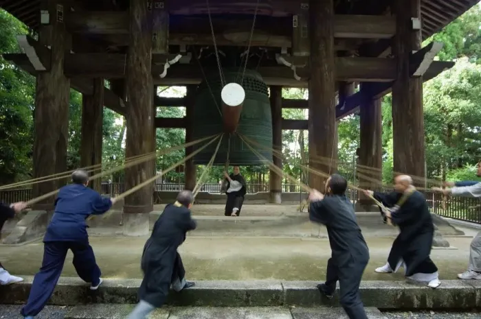 Framed Print : Monks pulling ropes of a large temple bell Print Framed Print : Monks pulling ropes of a large temple bell Print